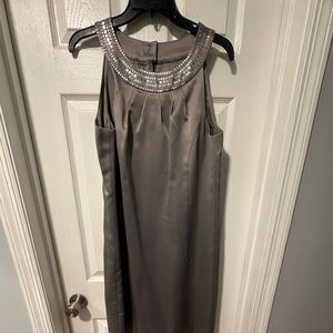 Knee-length silver occasion dress
NWT, does not include extra sequins